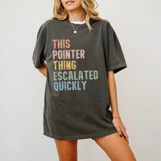 Model wearing a Pepper Comfort Colors® T-shirt with retro “This Pointer Thing Escalated Quickly” lettering
