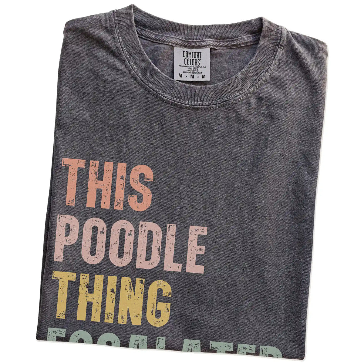 Folded Pepper Comfort Colors® T-shirt showing retro “This Poodle Thing Escalated Quickly” lettering