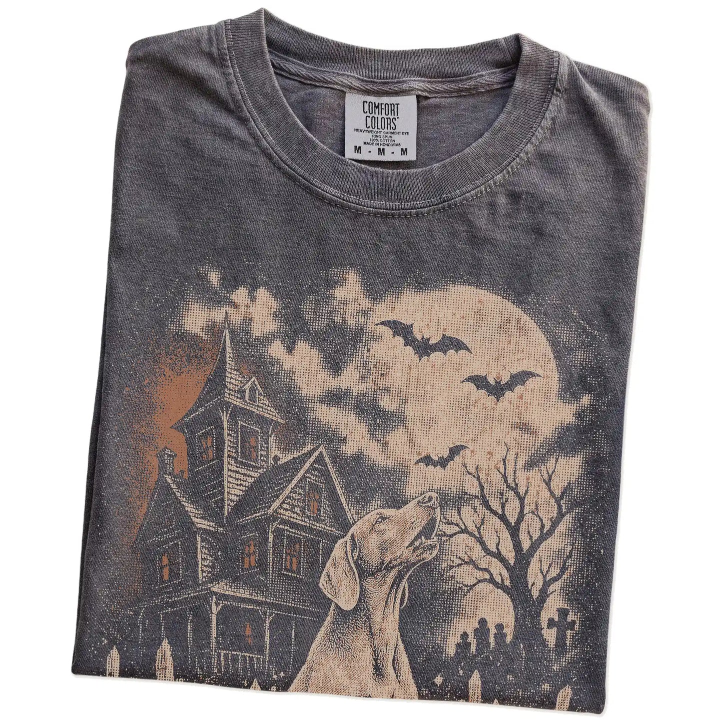 Folded Pepper Comfort Colors® T-shirt showing Weimaraner in a vintage haunted-house scene