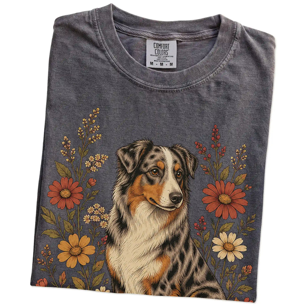 Folded Pepper Comfort Colors® T-shirt showing Australian Shepherd portrait surrounded by wildflowers beneath the moon