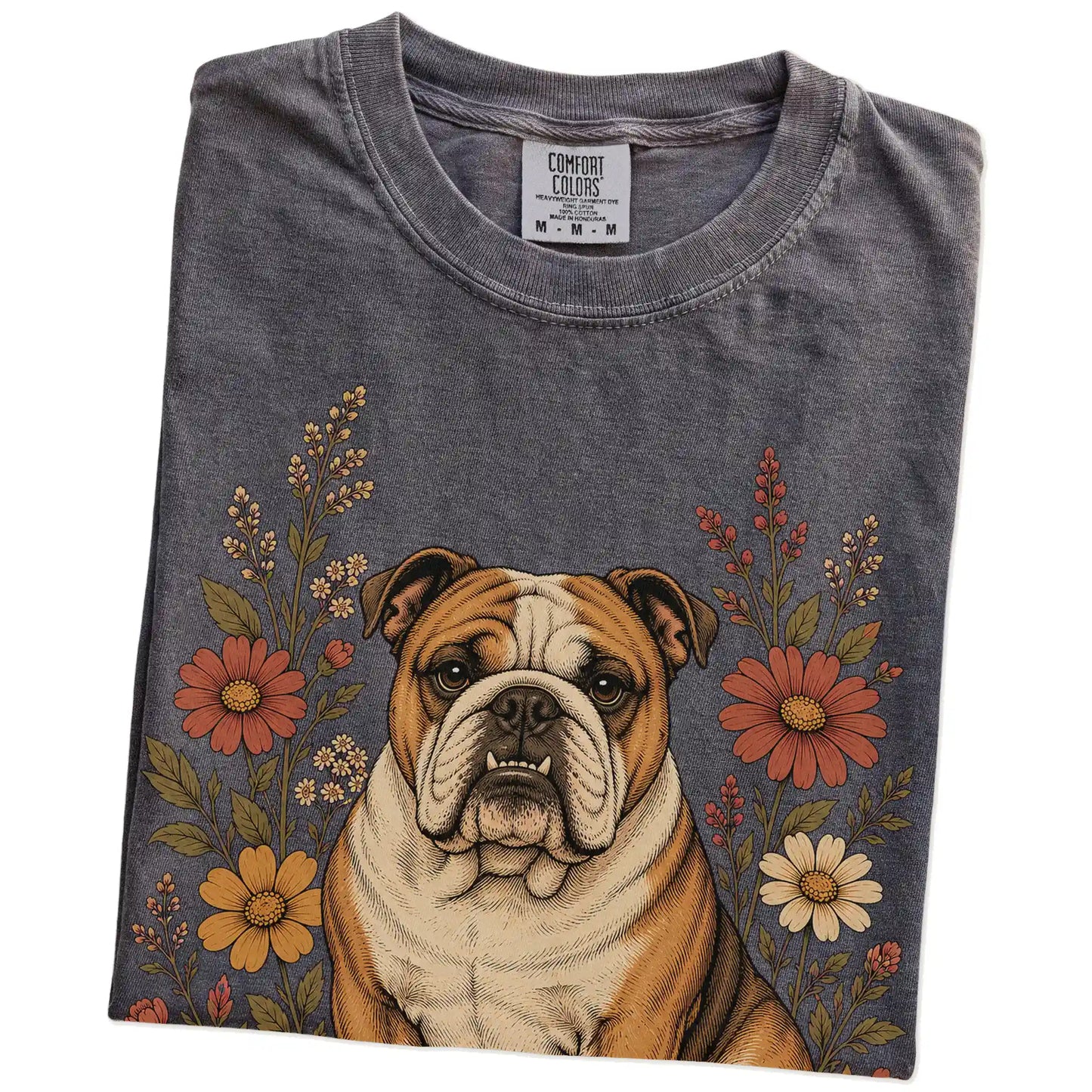 Folded Pepper Comfort Colors® T-shirt showing Bulldog portrait surrounded by wildflowers beneath the moon