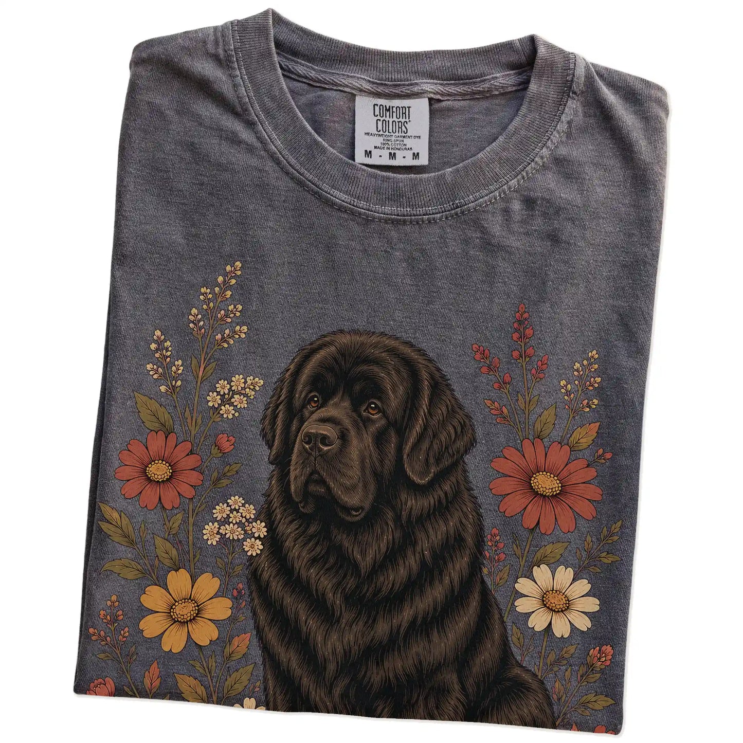 Folded Pepper Comfort Colors® T-shirt showing Newfie portrait surrounded by wildflowers beneath the moon