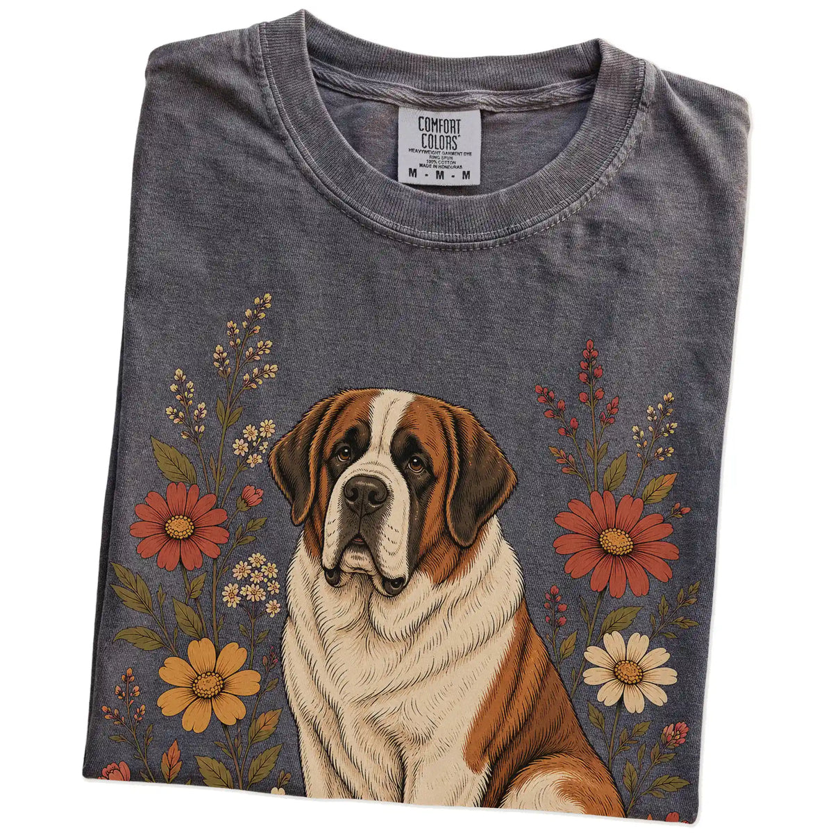 Folded Pepper Comfort Colors® T-shirt showing Saint Bernard portrait surrounded by wildflowers beneath the moon
