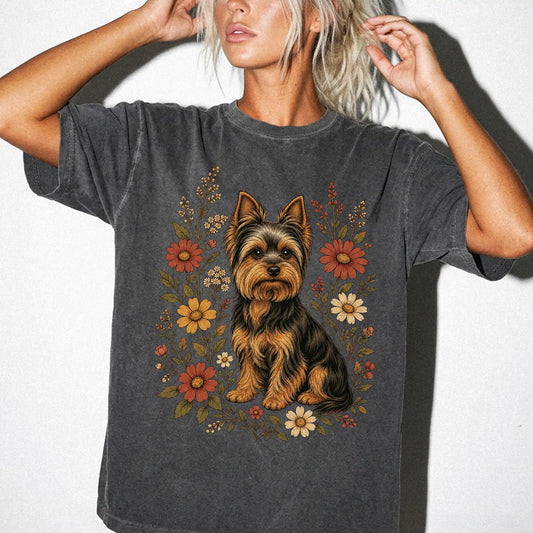 Model wearing a Pepper Comfort Colors® T-shirt showing Yorkie portrait surrounded by wildflowers beneath the moon