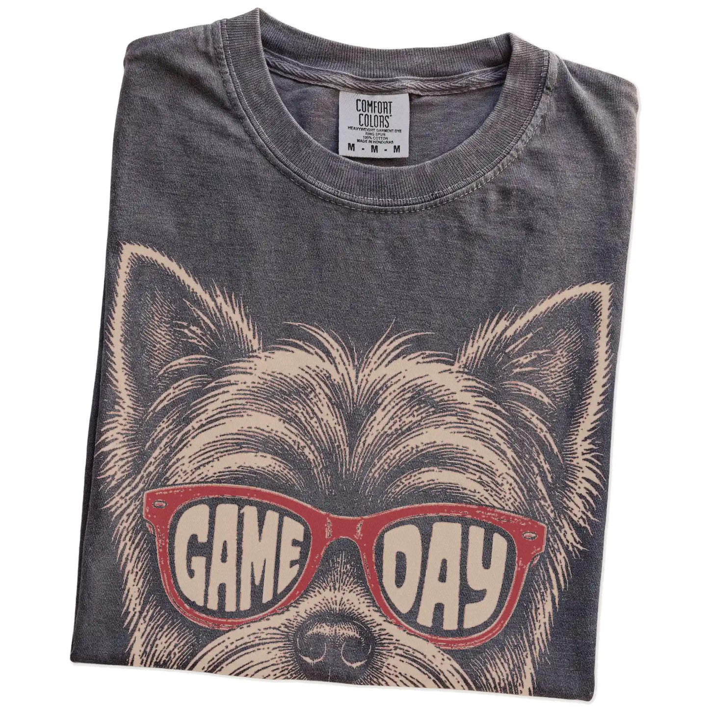 Folded Pepper Comfort Colors® T-shirt showing yorkie wearing red game day sunglasses
