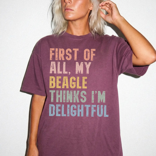 Model wearing a Berry Comfort Colors® T-shirt with “My Beagle thinks I’m delightful” text