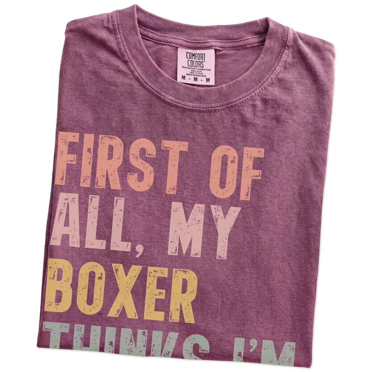 Folded Berry Comfort Colors® T-shirt showing “My Boxer thinks I’m delightful” text