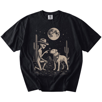 Cowboy alien fist-bumping a American Bulldog beneath the moon on a Black Comfort Colors® T-shirt