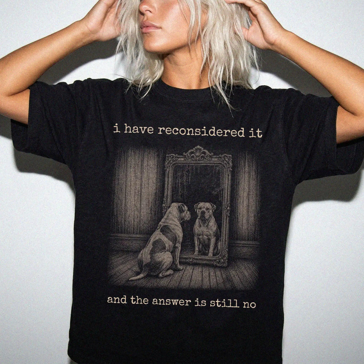 Model wearing a Black Comfort Colors® T-shirt with “the answer is still no” american bulldog design