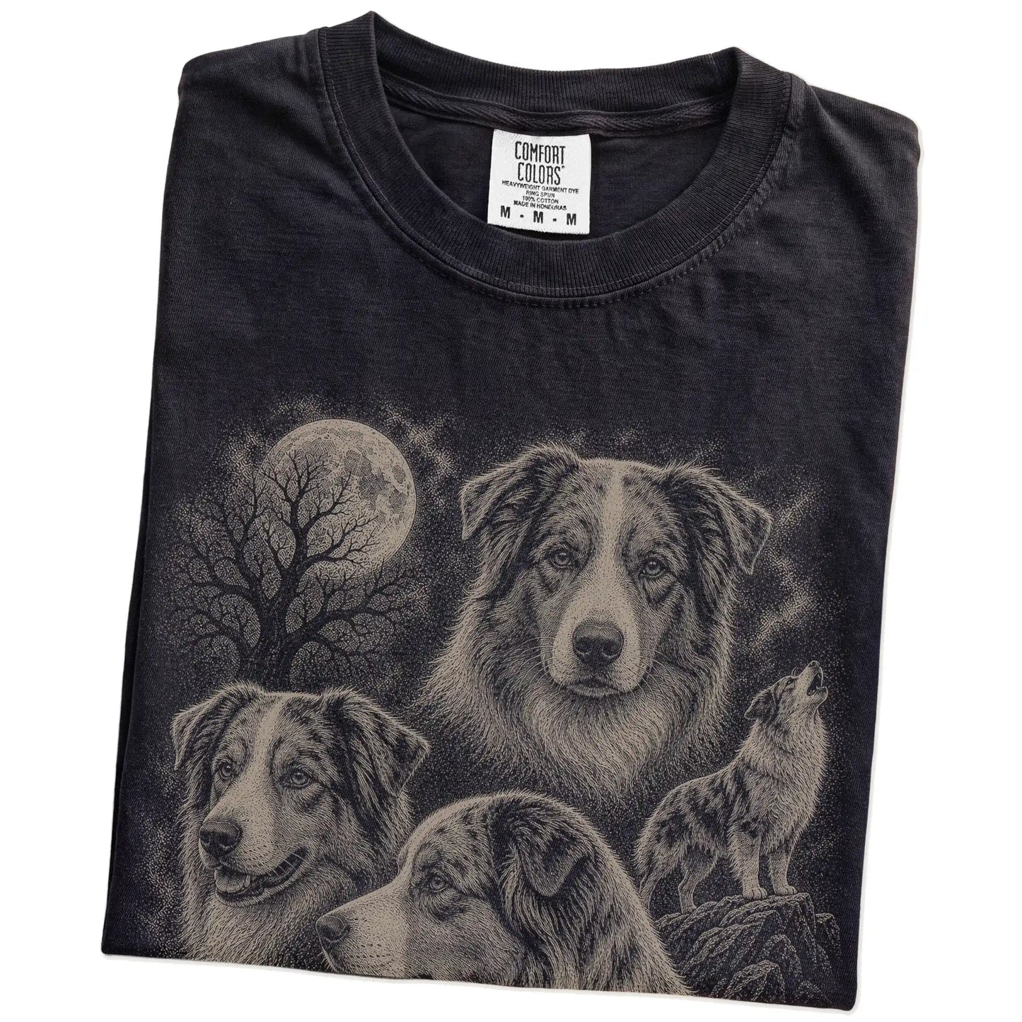 Folded Black Comfort Colors® T-shirt showing a vintage moon montage featuring Australian Shepherd