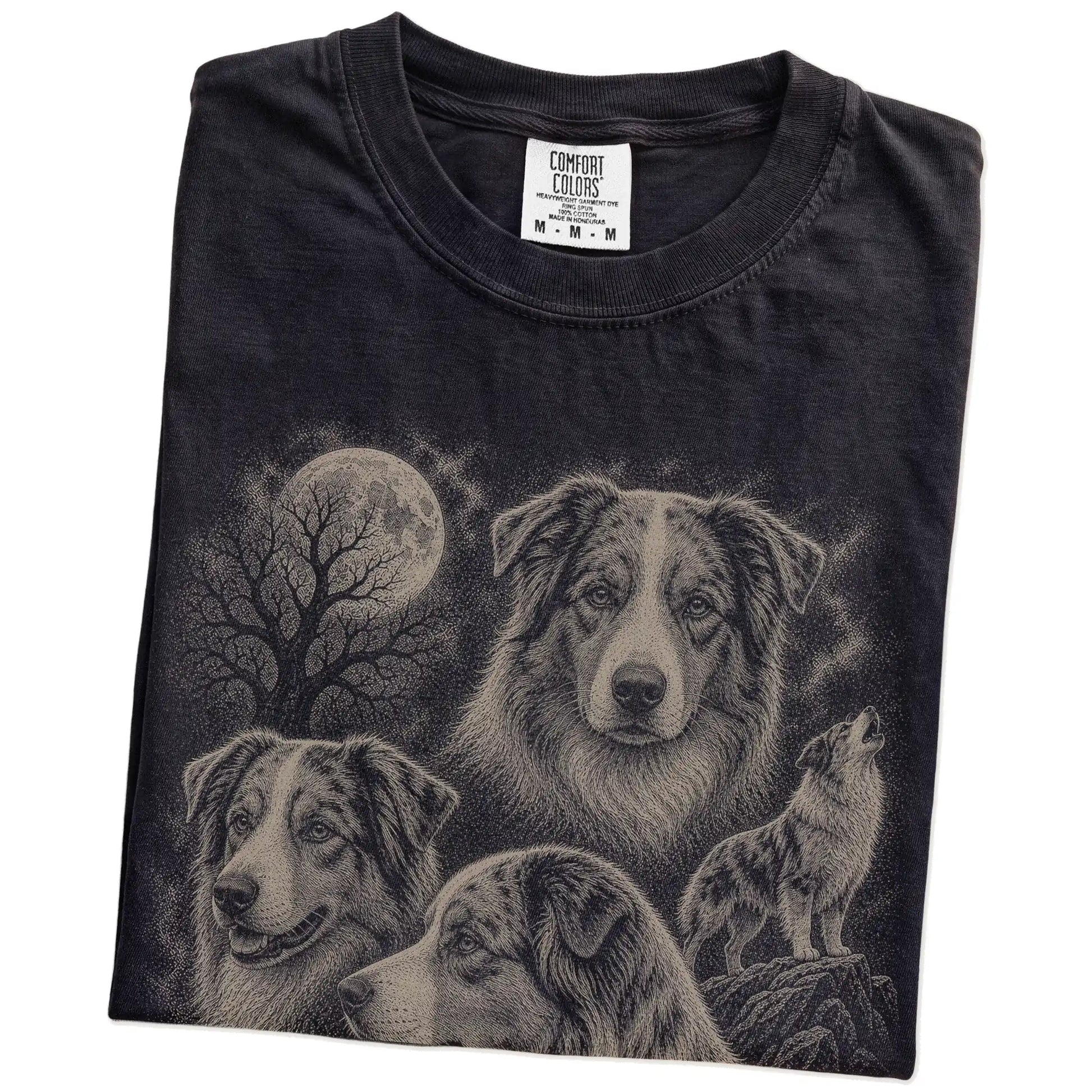 Folded Black Comfort Colors® T-shirt showing a vintage moon montage featuring Australian Shepherd