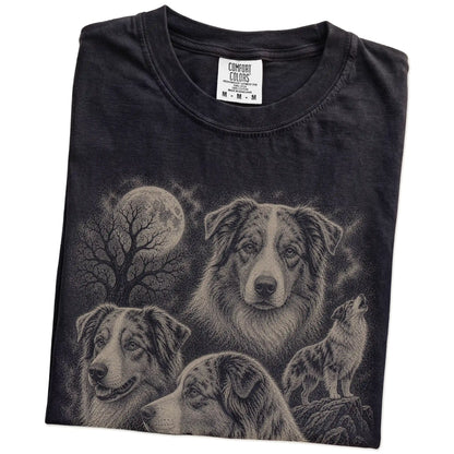 Folded Black Comfort Colors® T-shirt showing a vintage moon montage featuring Australian Shepherd