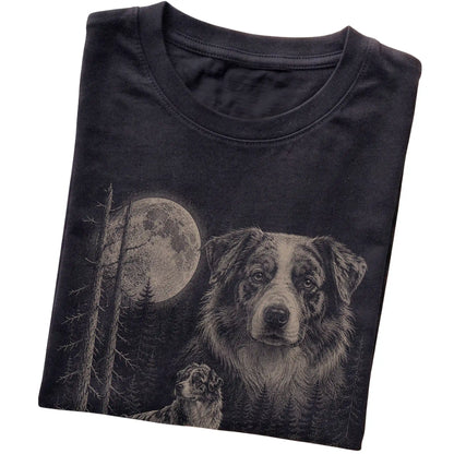 Folded black Softstyle T-shirt showing the Australian Shepherd Moonlit Forest graphic