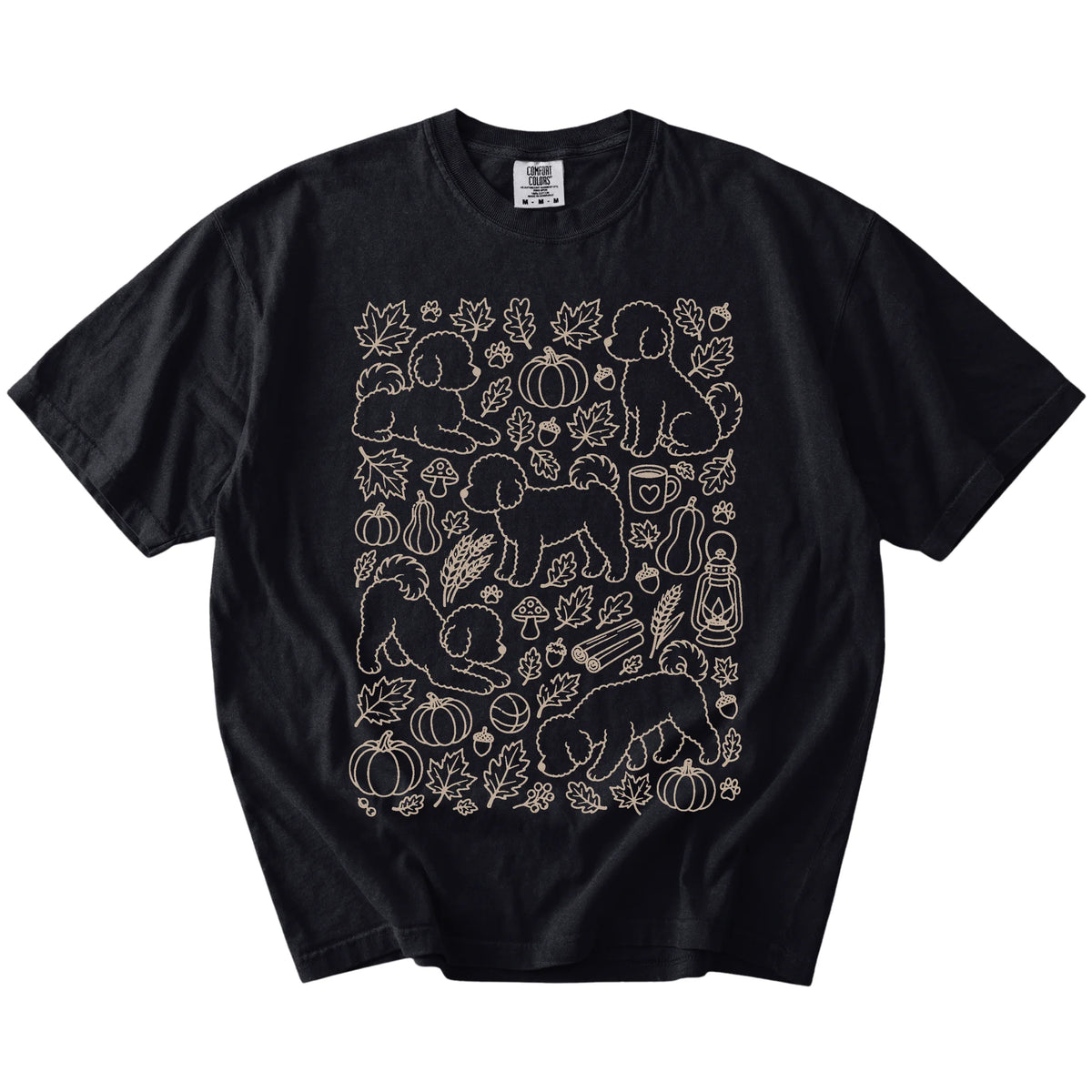 Bichon Frise dogs with pumpkins, leaves, acorns, and woodland details on a Black Comfort Colors® T-shirt