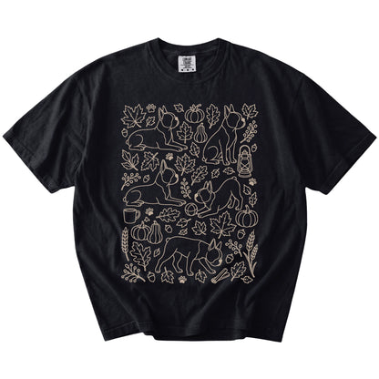 Boston Terrier dogs with pumpkins, leaves, acorns, and woodland details on a Black Comfort Colors® T-shirt