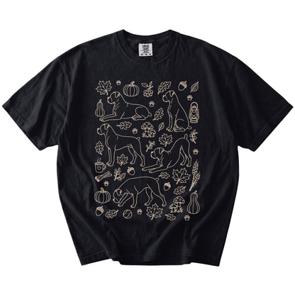 Boxer dogs with pumpkins, leaves, acorns, and woodland details on a Black Comfort Colors® T-shirt