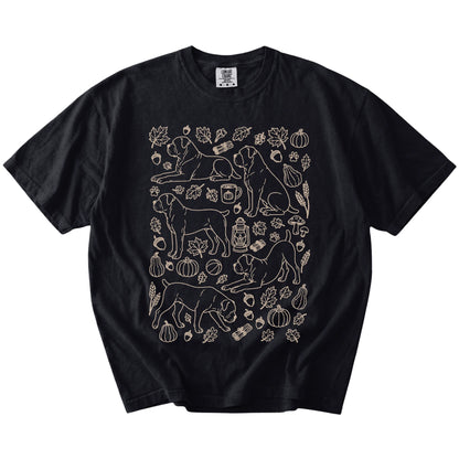 Cane Corso dogs with pumpkins, leaves, acorns, and woodland details on a Black Comfort Colors® T-shirt