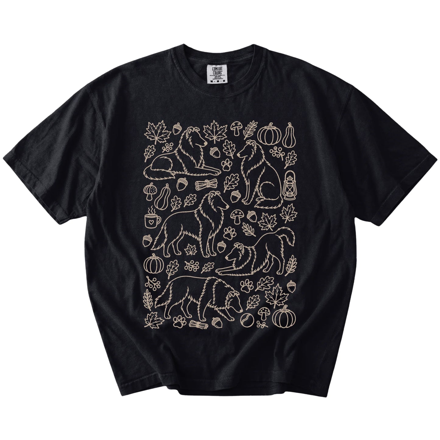 Collie dogs with pumpkins, leaves, acorns, and woodland details on a Black Comfort Colors® T-shirt