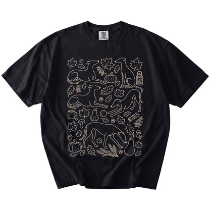 Greyhound dogs with pumpkins, leaves, acorns, and woodland details on a Black Comfort Colors® T-shirt