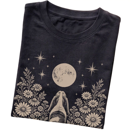 Black T-shirt featuring Wildflower Moon Basset Hound, folded presentation