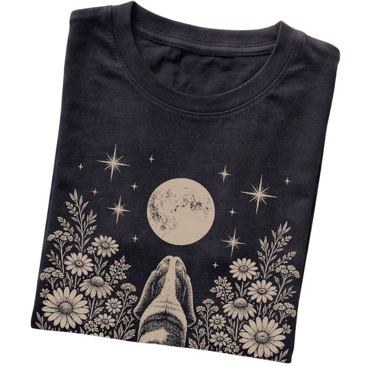 Black T-shirt featuring Wildflower Moon Basset Hound, folded presentation