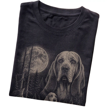 Folded black Softstyle T-shirt showing the Basset Hound Moonlit Forest graphic