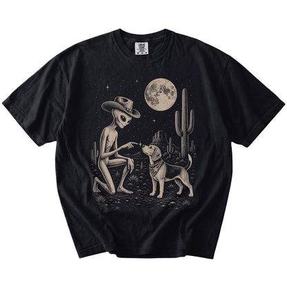 Cowboy alien fist-bumping a Beagle beneath the moon on a Black Comfort Colors® T-shirt