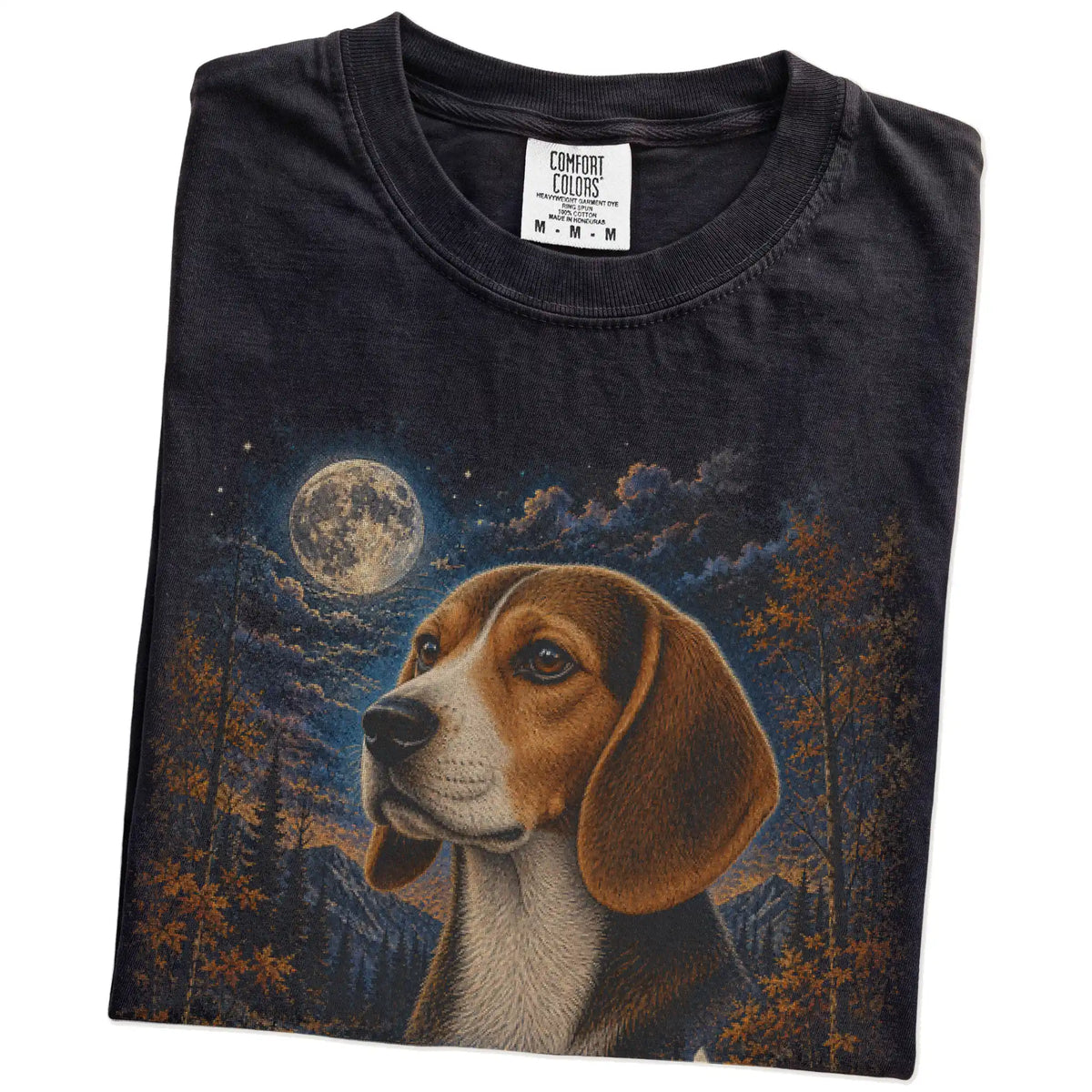 Folded Black Comfort Colors® t-shirt showing Beagle in a fall forest graphic