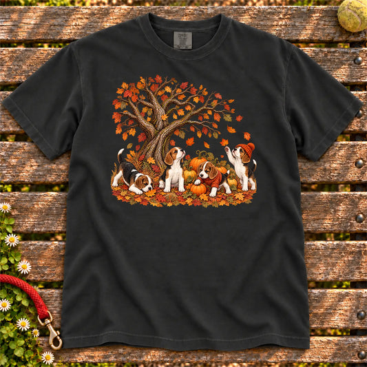 Four Beagle puppies with pumpkins beneath an autumn tree on a Black garment-dyed T-shirt