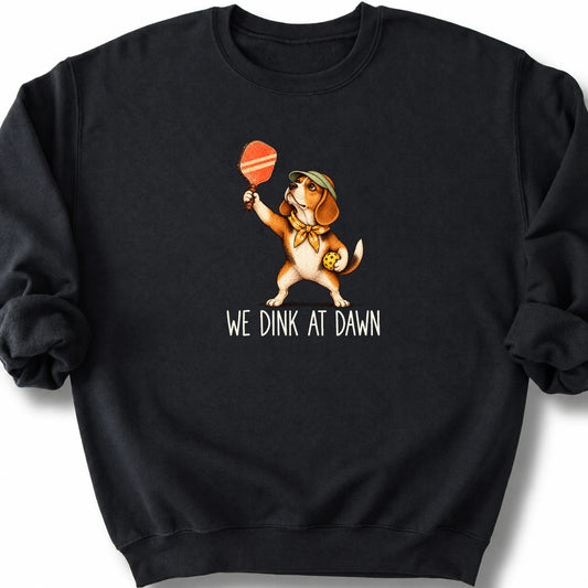 Beagle with a pickleball paddle and ball on a Black Gildan® sweatshirt with We Dink at Dawn text