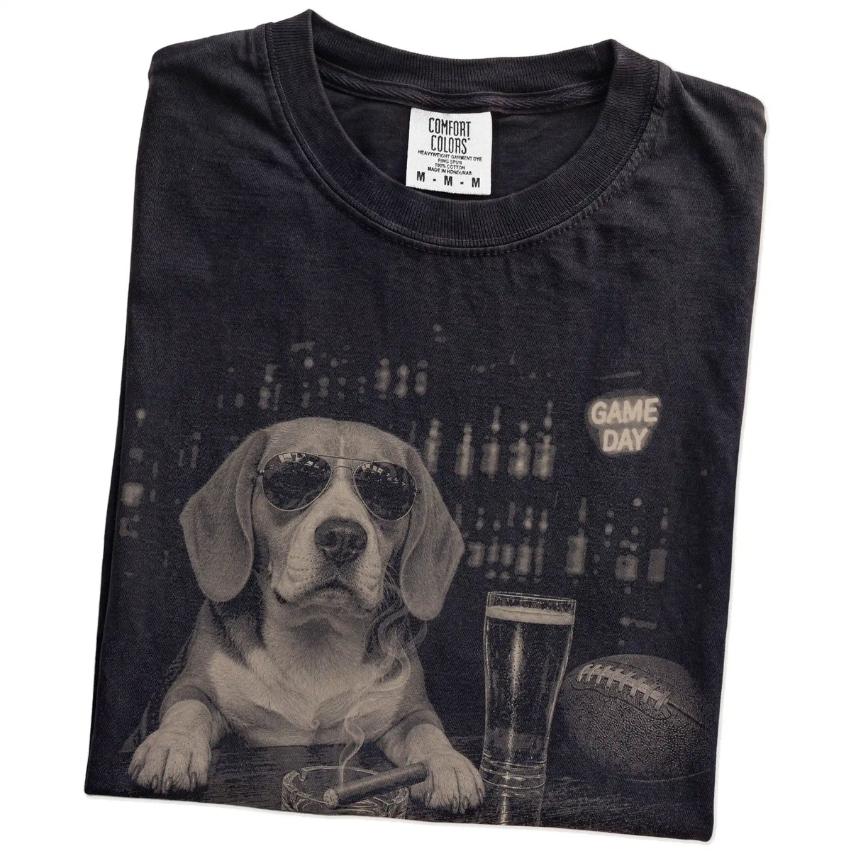 Folded Black Comfort Colors® T-shirt showing Beagle with beer and football graphics