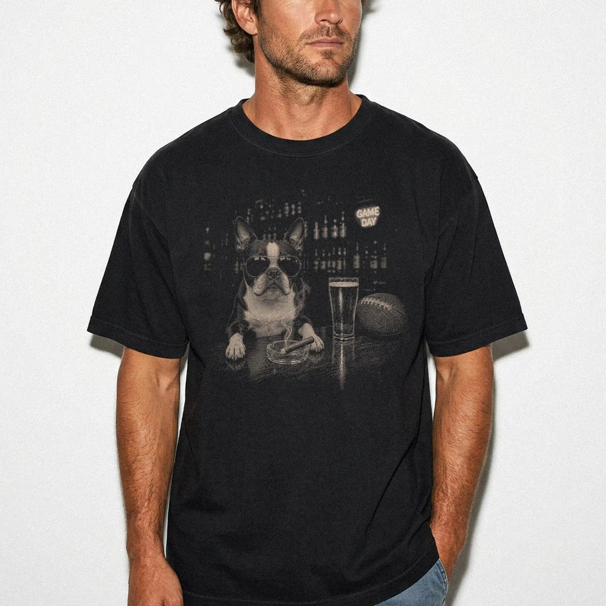 Model wearing a Black Comfort Colors® T-shirt featuring Boston Terrier with beer and football graphics