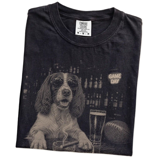 Folded Black Comfort Colors® T-shirt showing Springer Spaniel with beer and football graphics