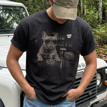 Model wearing a Black Comfort Colors® T-shirt featuring French Bulldog with beer and football graphics