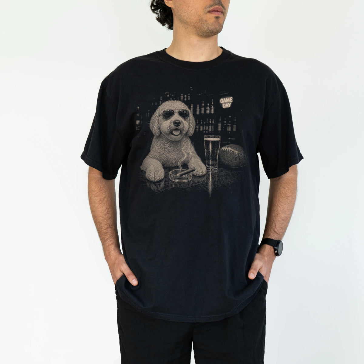 Model wearing a Black Comfort Colors® T-shirt featuring Goldendoodle with beer and football graphics