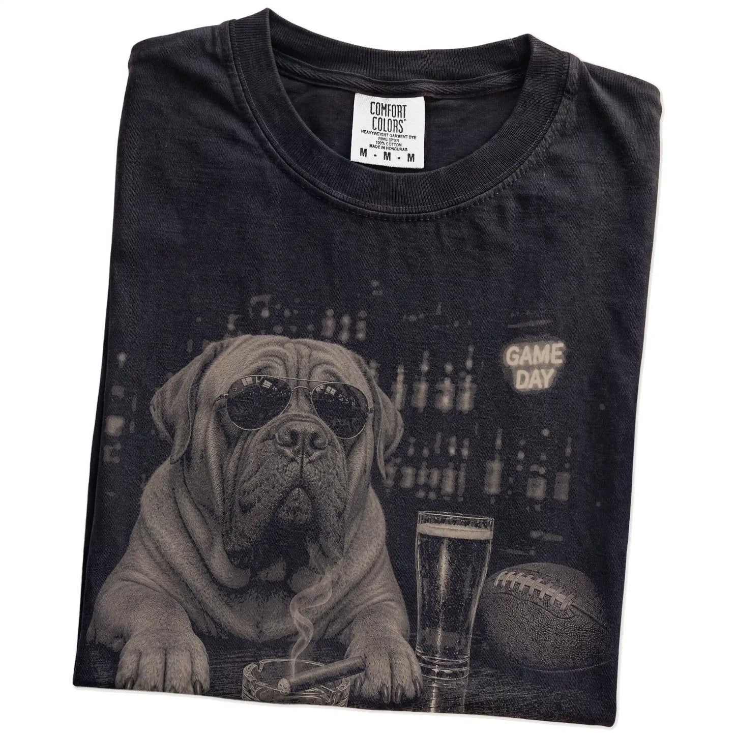 Folded Black Comfort Colors® T-shirt showing Mastiff with beer and football graphics