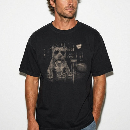 Model wearing a Black Comfort Colors® T-shirt featuring Pitbull with beer and football graphics