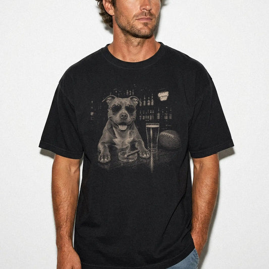 Model wearing a Black Comfort Colors® T-shirt featuring Pitbull with beer and football graphics