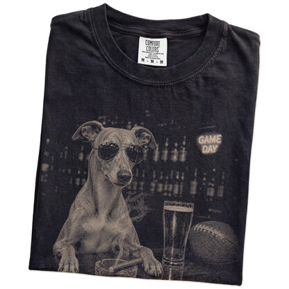 Folded Black Comfort Colors® T-shirt showing Whippet with beer and football graphics