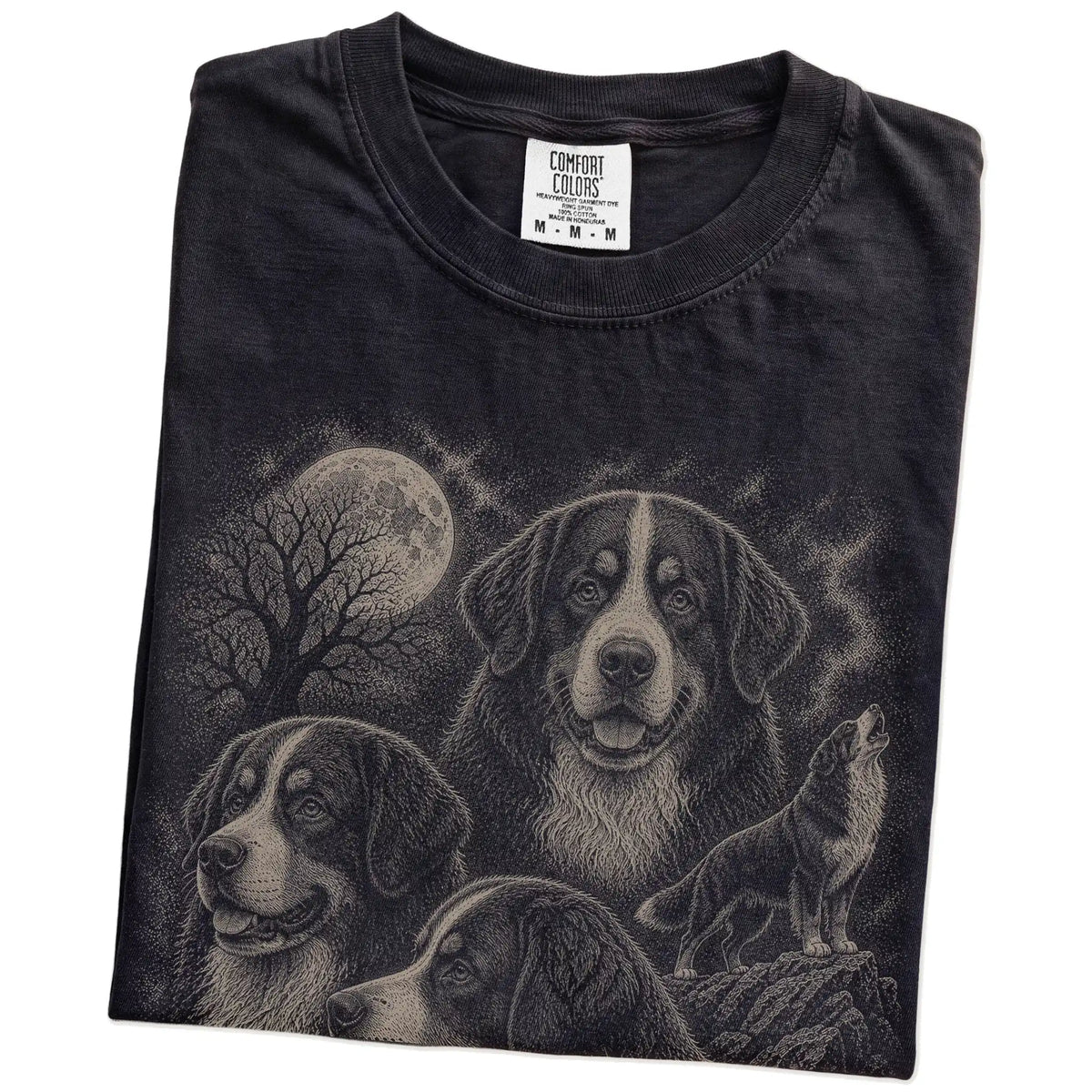 Folded Black Comfort Colors® T-shirt showing a vintage moon montage featuring Bernese Mountain Dog