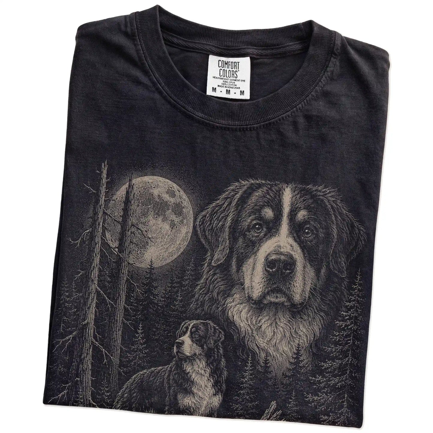 Folded Black Bernese Mountain Dog Moonlit Forest T-Shirt showing the graphic