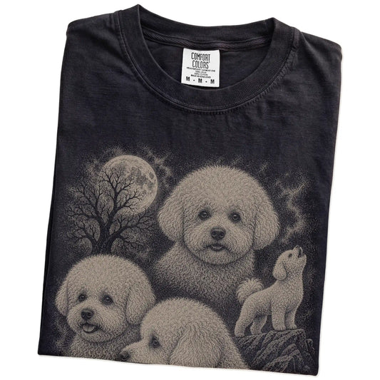 Folded Black Comfort Colors® T-shirt showing a vintage moon montage featuring Bichon Frise