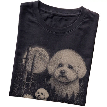 Folded black Softstyle T-shirt showing the Bichon Frise Moonlit Forest graphic