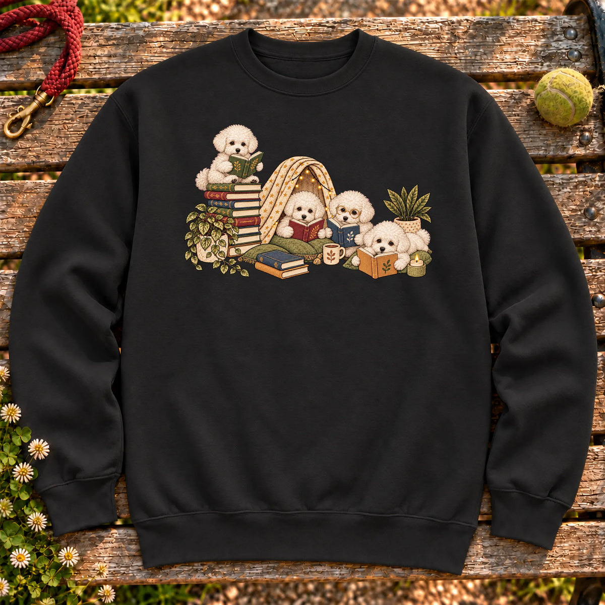 Bichon Frise puppies reading books in a cozy blanket fort on a Black sweatshirt