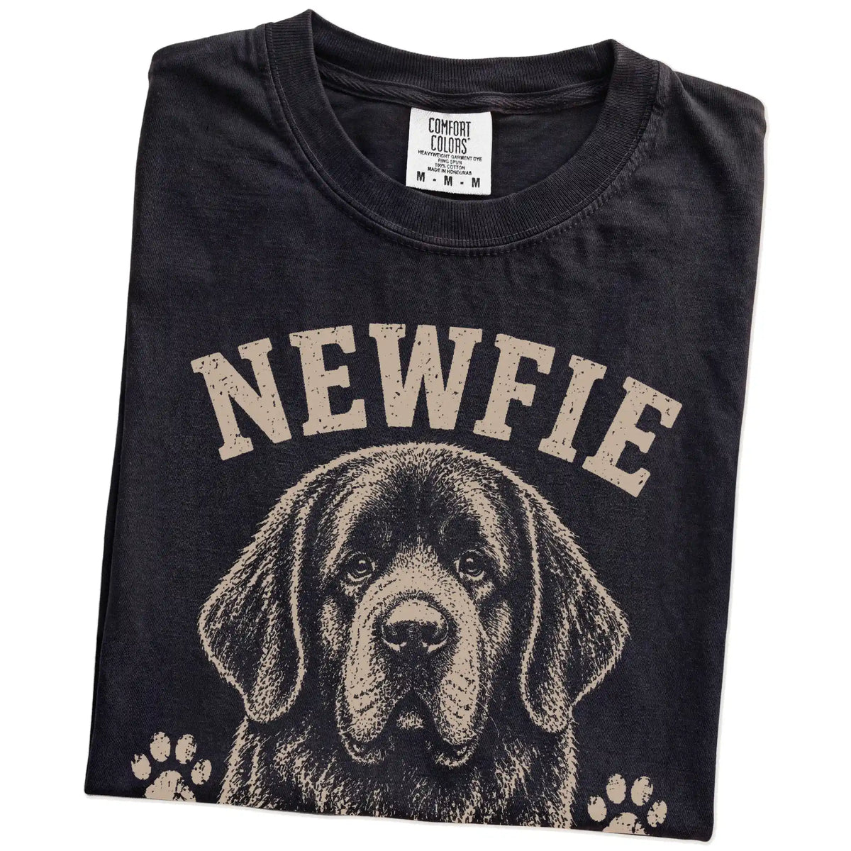 Folded Black Comfort Colors® T-shirt showing Newfie design with “Big Hair, Bigger Heart” lettering