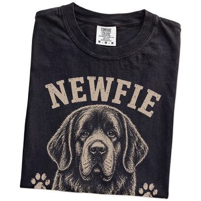 Folded Black Comfort Colors® T-shirt showing Newfie design with “Big Hair, Bigger Heart” lettering