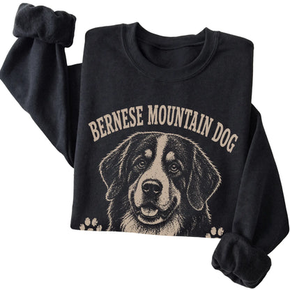 Black crewneck sweatshirt featuring Big Softie, Mountain Strong - Bernese Mountain Dog, folded presentation