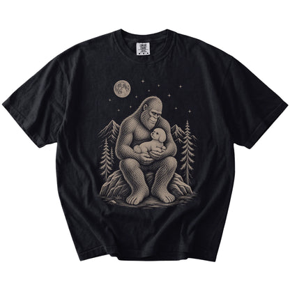 Bigfoot holding a Bichon Frise on a Black Comfort Colors® T-shirt