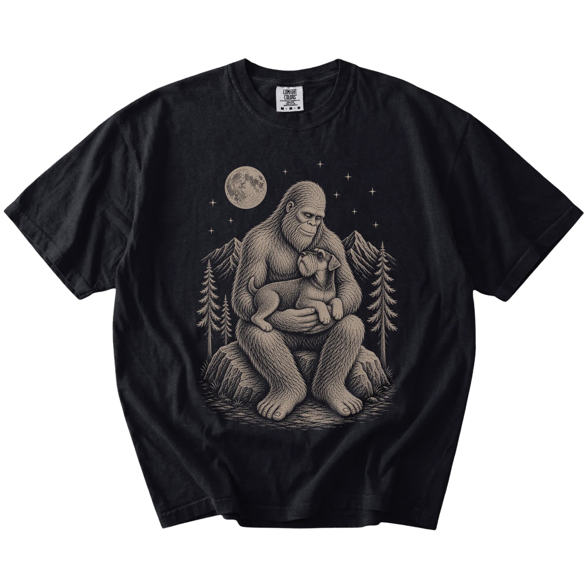 Bigfoot holding a Standard Schnauzer on a Black Comfort Colors® T-shirt