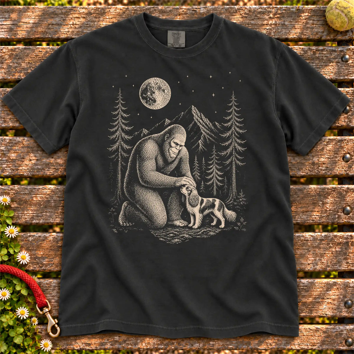 Cavalier King Charles Spaniel Bigfoot Petting on a Black T-shirt, shown flat